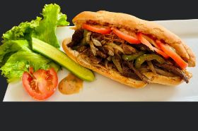 Mixed sauté onion, tomato sauce, vermicelli, avocado oil, black pepper, bouillon chicken, butter, powder onion, garlic along with Bassam bambam sauce. Tender saute beef, sliced tomatoes on baguette bread, serve with chips, and can soda.